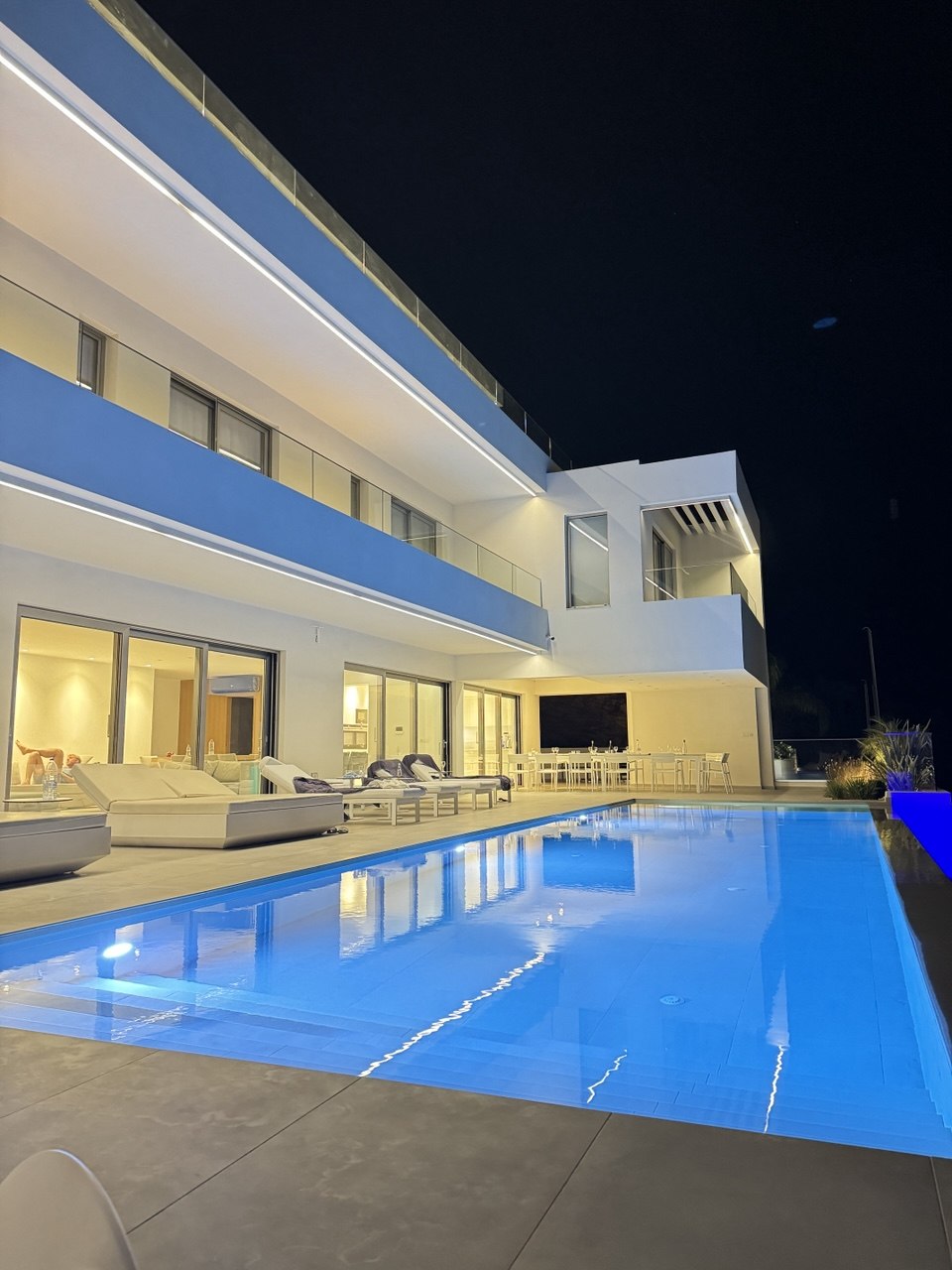 Crete villa pool glowing at night