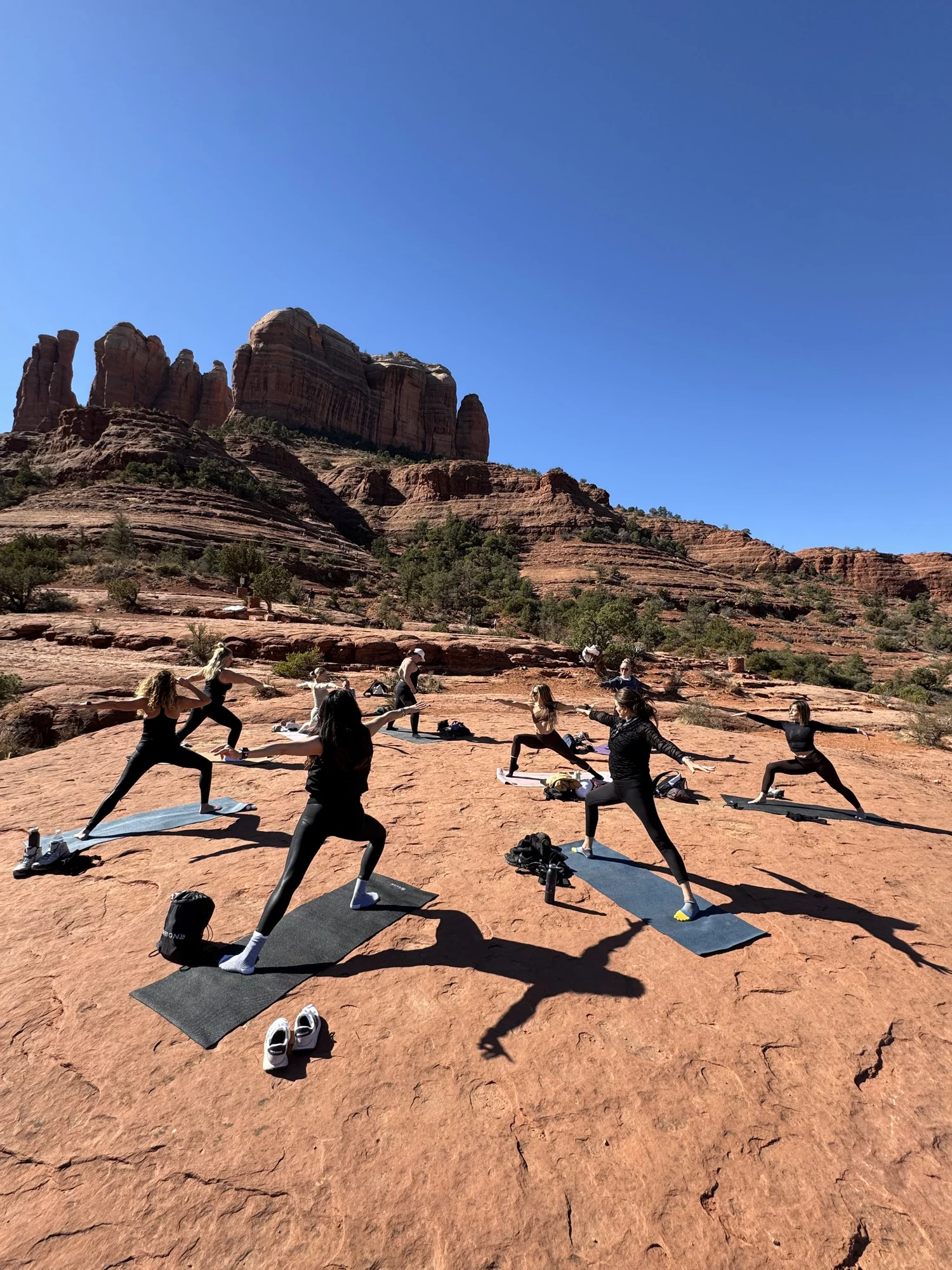 Sedona group yoga practice on the rocks